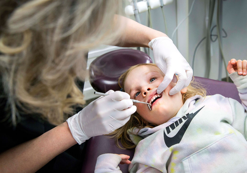 Child getting a dental checkup